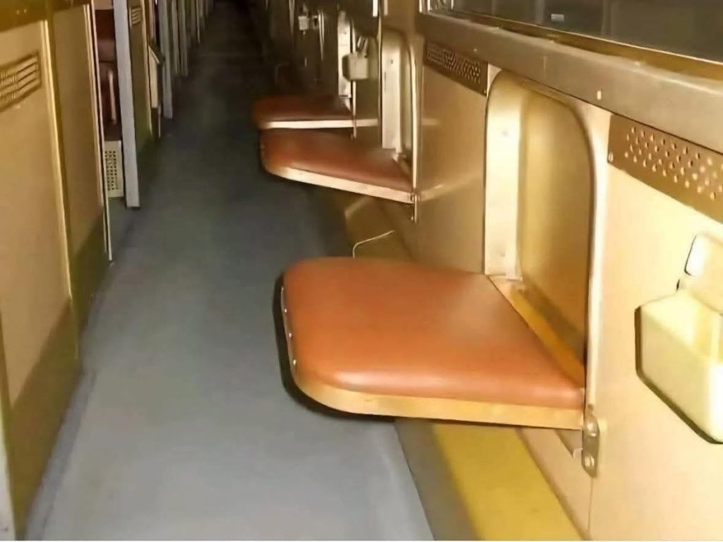 Old school train corridor seat on a Polish train from the 80s and 90s. 